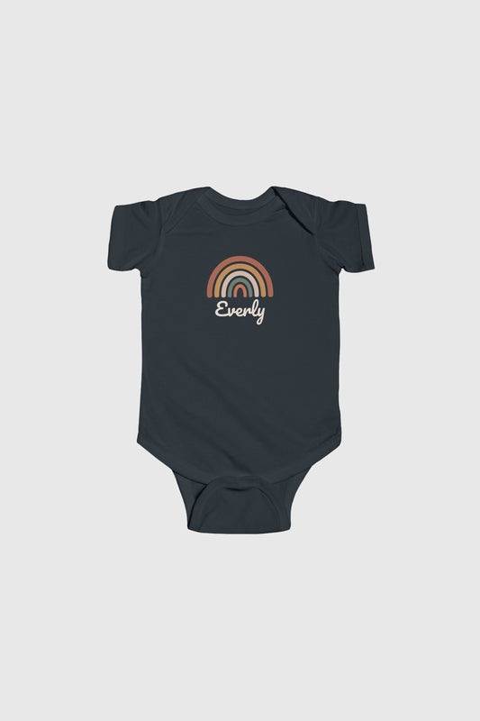 Baby wearing white personalized rainbow bodysuit, snap closure