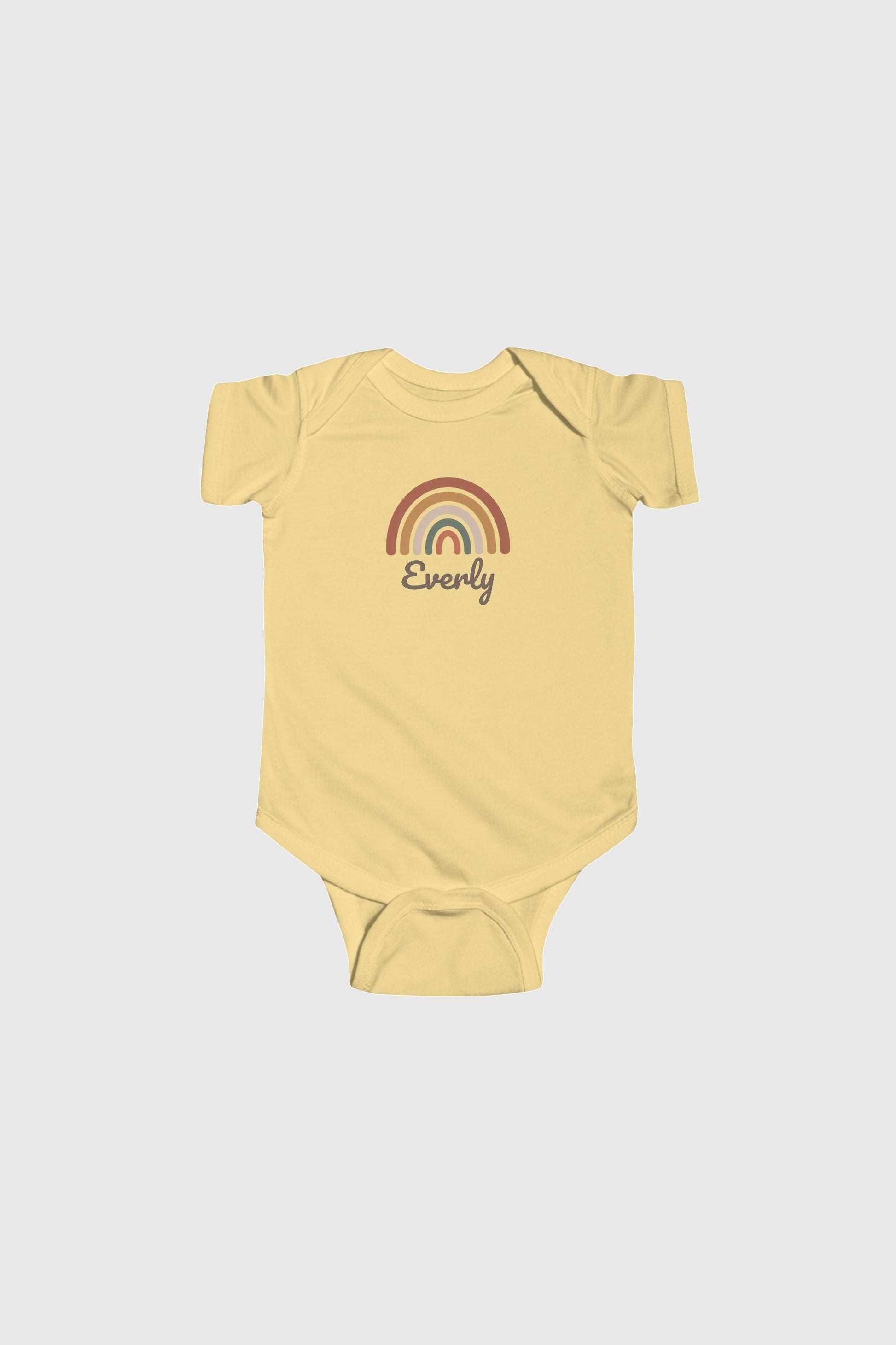 Baby wearing pink personalized rainbow bodysuit