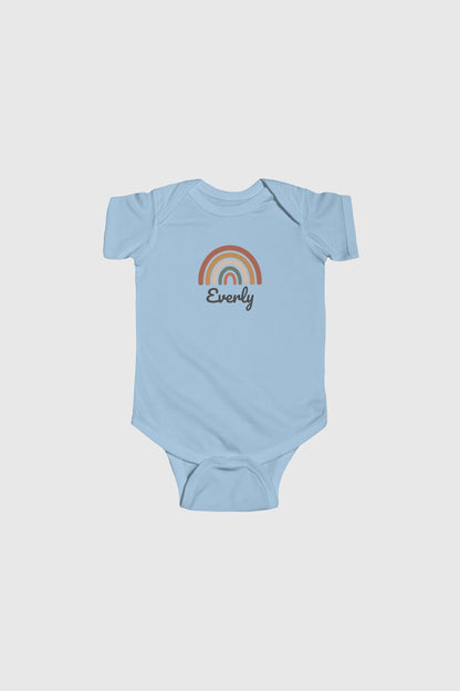 Yellow personalized rainbow baby bodysuit with custom name, snap closure