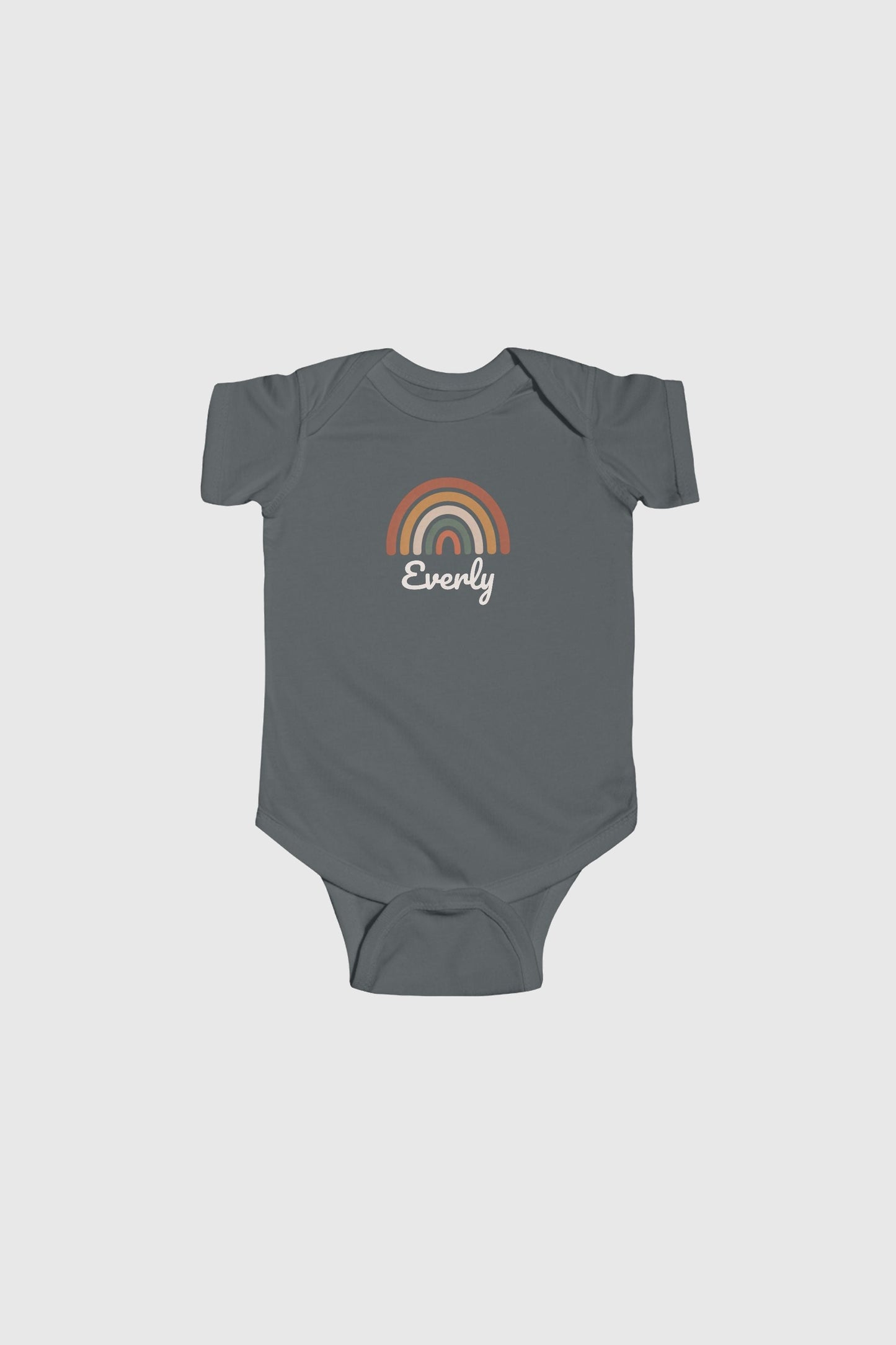 Baby wearing yellow personalized rainbow bodysuit