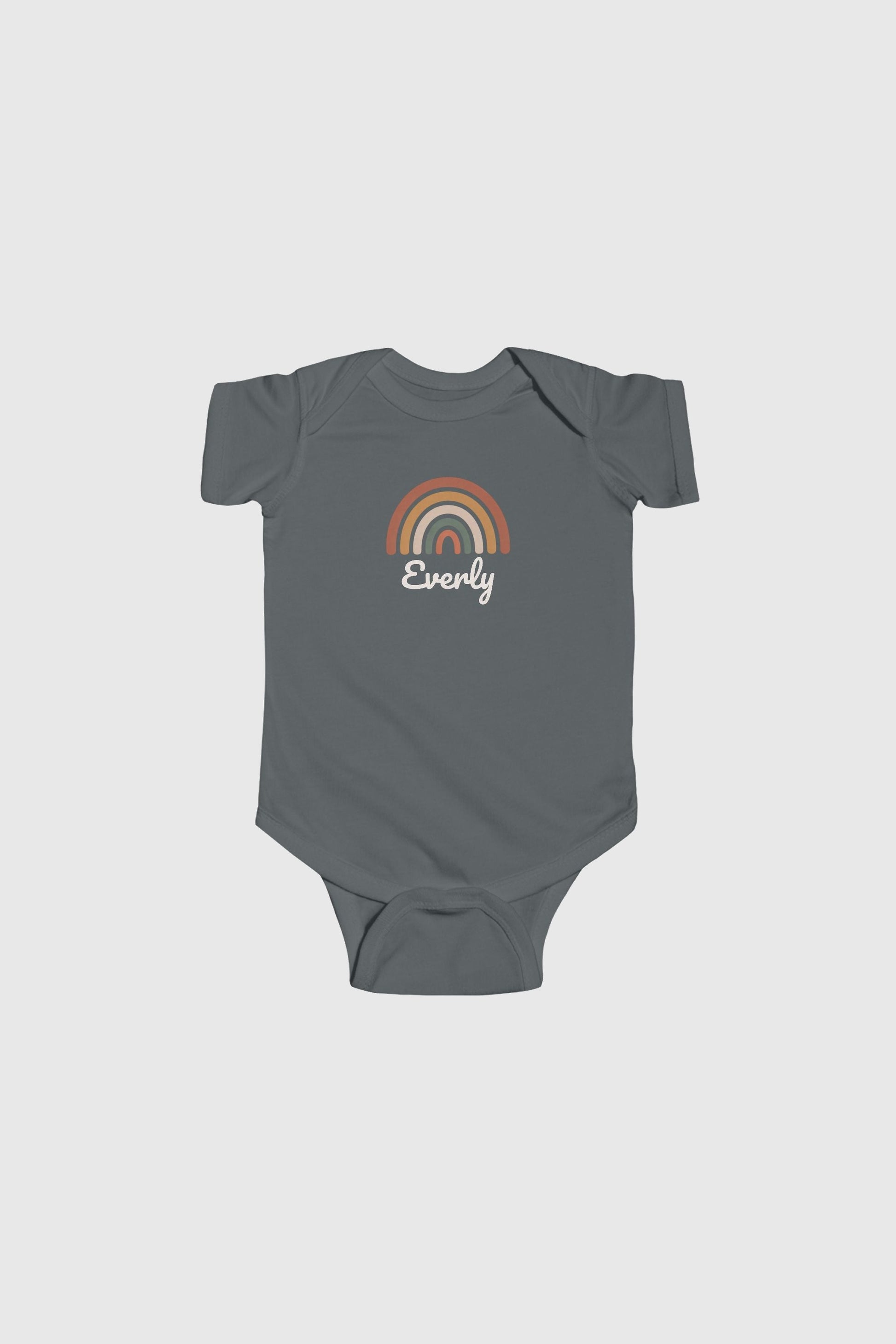 Baby wearing yellow personalized rainbow bodysuit