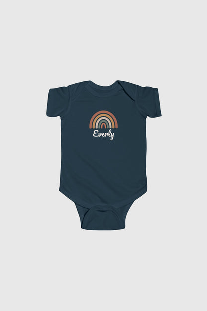 Light blue personalized rainbow baby bodysuit with custom name, snap closure