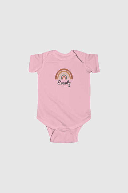 Baby wearing light blue personalized rainbow bodysuit