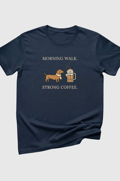 Navy blue t-shirt with a graphic of a dog and coffee cup and text 'Morning walk. Strong coffee.' on a light gray background.