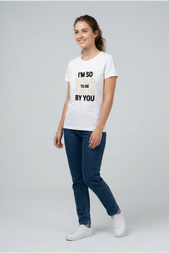 Woman wearing white t-shirt with im so proud funny mom print