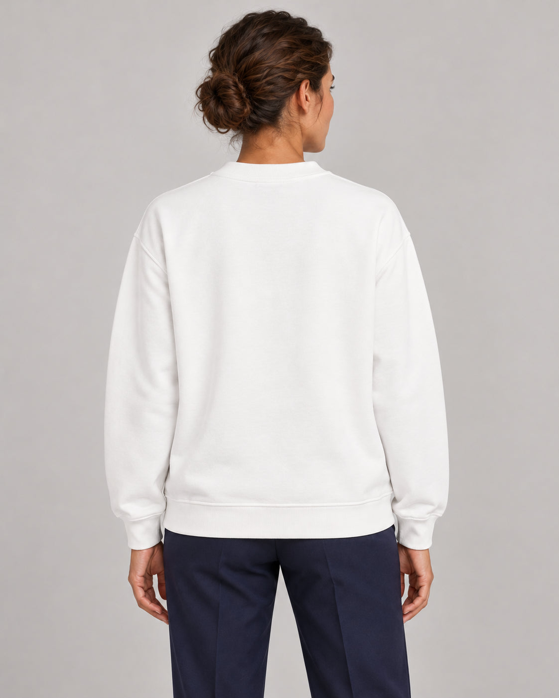 Woman wearing Swing dachshund golf sweatshirt, back studio view. Color: White