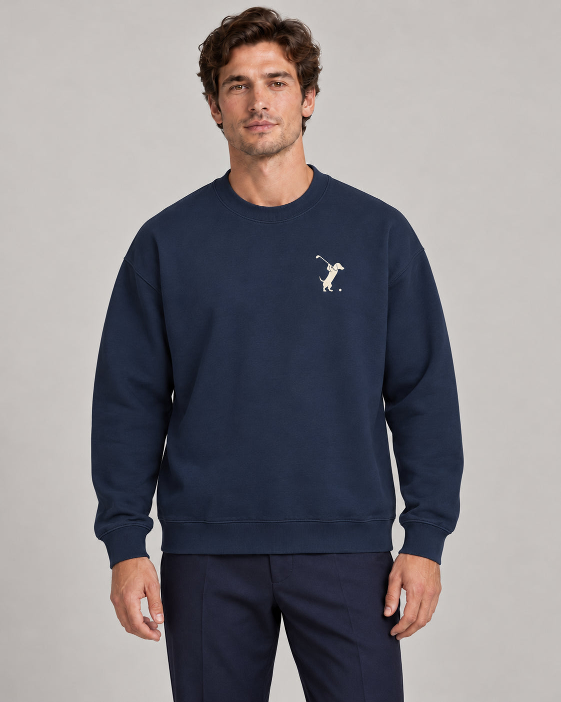 Man wearing Swing dachshund golf sweatshirt, front studio view. Color: Navy