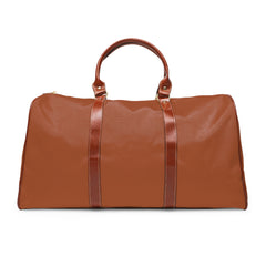Color: Cognac. Club Mark golf travel bag in cognac, plain back view with brown PU handles.