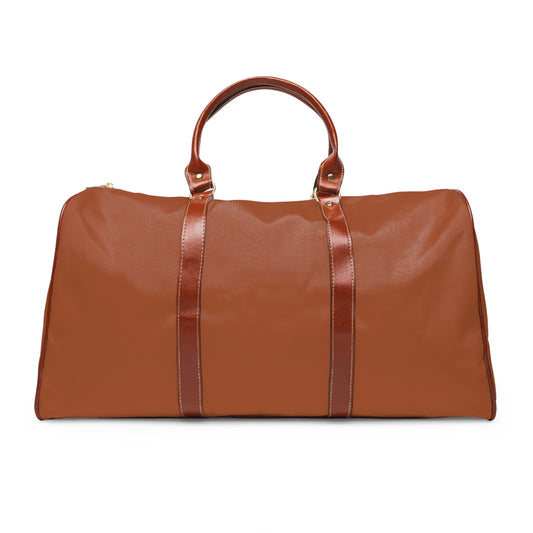 Color: Cognac. Club Mark golf travel bag in cognac, plain back view with brown PU handles.