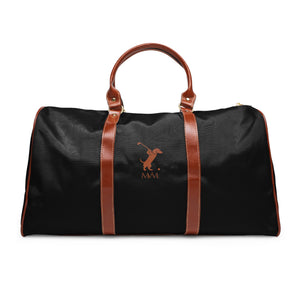 Color: Black. Swing Dachshund golf travel bag in black with a brown swinging dachshund and MVM monogram on the front, brown PU handles, front view.