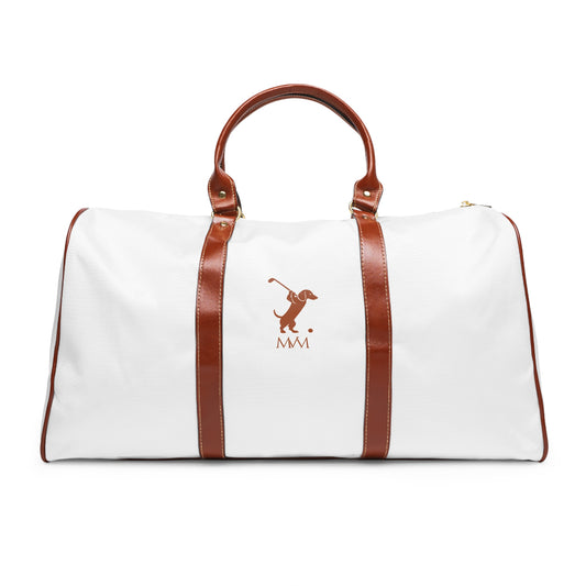 Color: White. Swing Dachshund golf travel bag in white with a brown swinging dachshund and MVM monogram on the front, brown PU handles, front view.