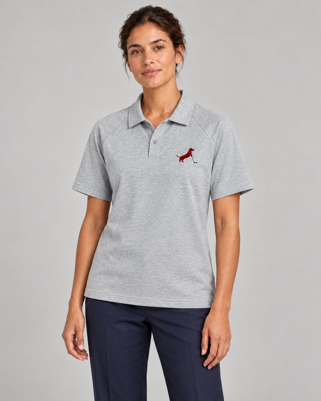Woman wearing Putting dachshund golf polo, front studio view. Color: Flower Gray