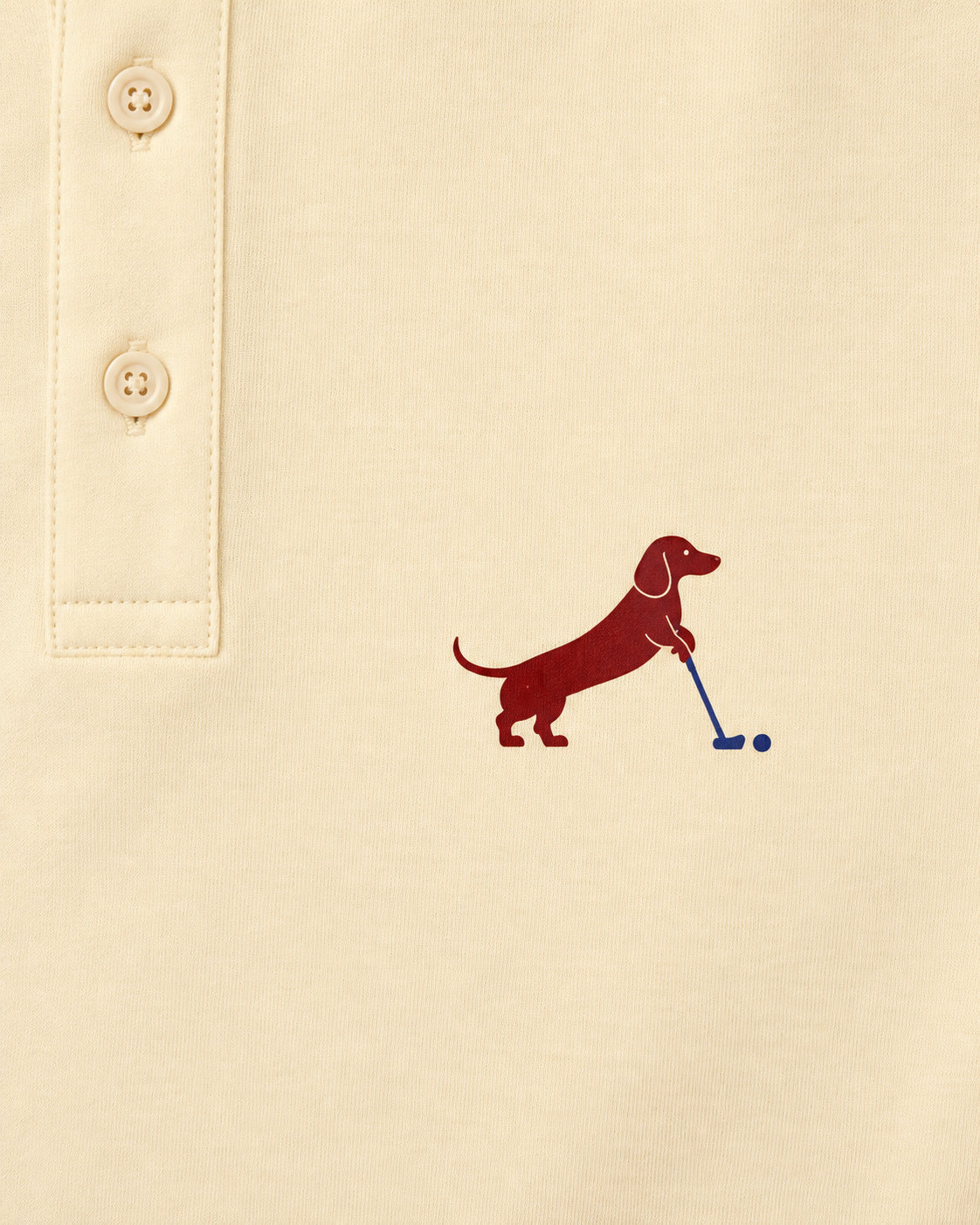 Putting dachshund golf polo, chest logo detail. Color: Apricot