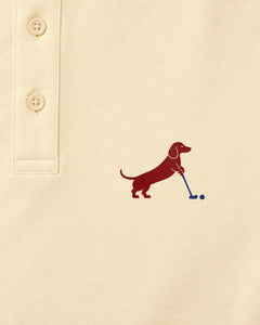 Putting dachshund golf polo, chest logo detail. Color: Apricot