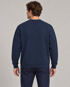 Man wearing Swing dachshund golf sweatshirt, back studio view. Color: Navy