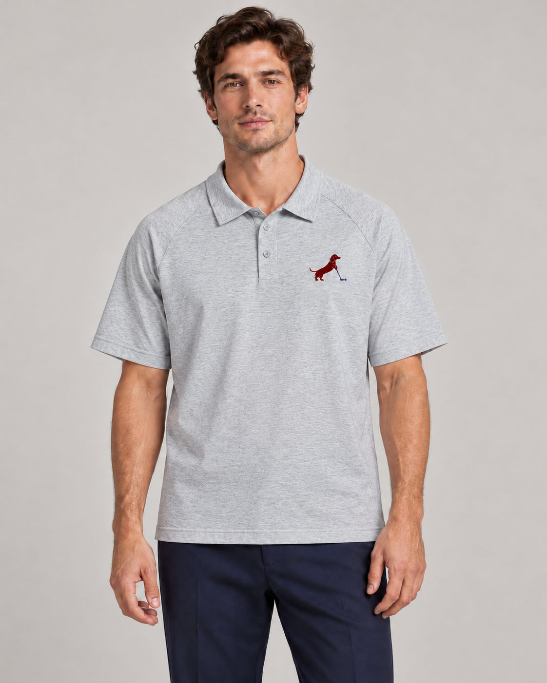 Man wearing Putting dachshund golf polo, front studio view. Color: Flower Gray