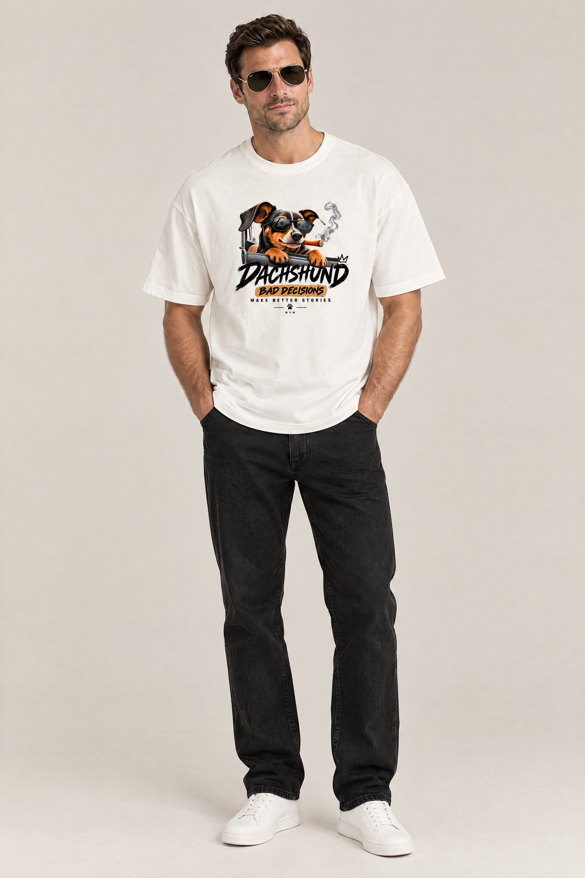 Man in aviator sunglasses wearing the Bad Decisions Dachshund Tee in white with black jeans. Color: White