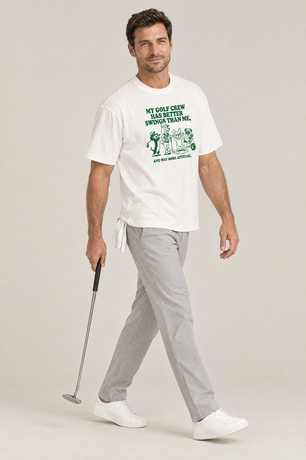 Man walking with a putter in the white Better Swings Dog Golf Tee. Color: White