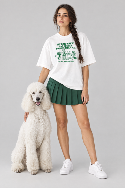 Woman wearing the Better Swings Dog Golf Tee in white with a white standard poodle. Color: White