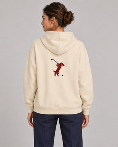 Woman wearing Club & Swing dachshund golf hoodie, back studio view. Color: Apricot