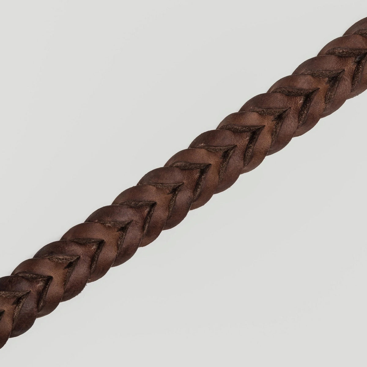 Brown leather dog collar side view, adjustable strap