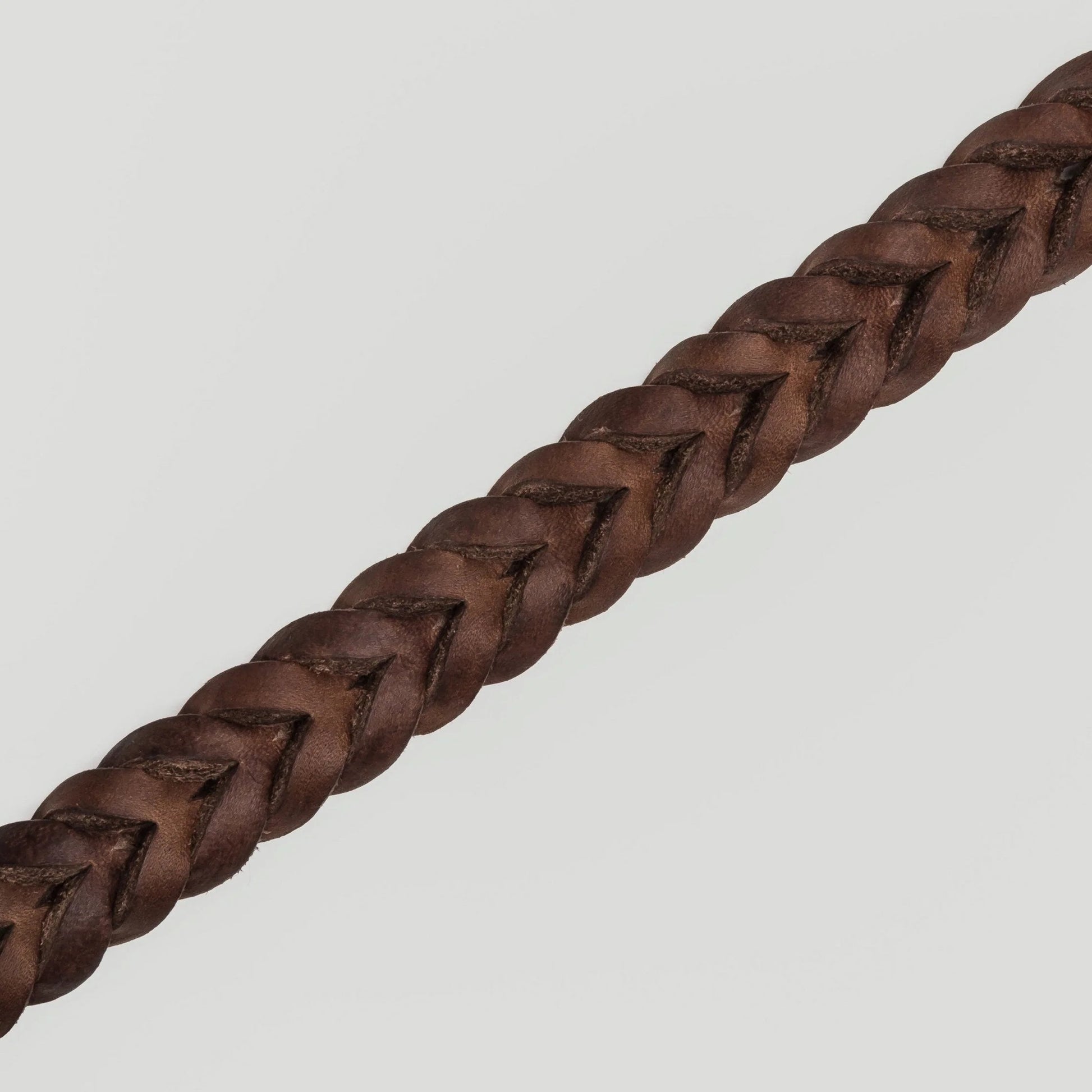 Brown leather dog collar side view, adjustable strap