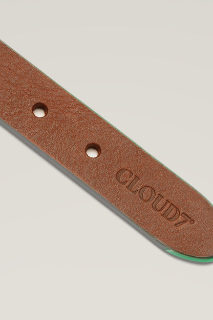 Embossed CLOUD7 lettering and green edge of the Kings Park vegetable-tanned leather dog collar, close-up
