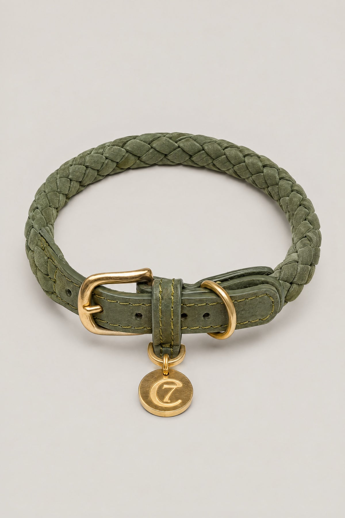 Olive green braided nubuck Cloud 7 Ravello dog collar with brass buckle and logo coin, front view