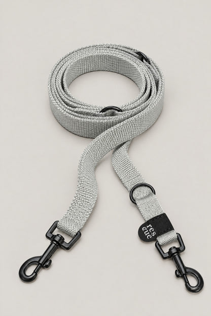 Silver grey nylon Cloud 7 RESC7UE dog leash with black snap hooks and rescue tag, coiled front view