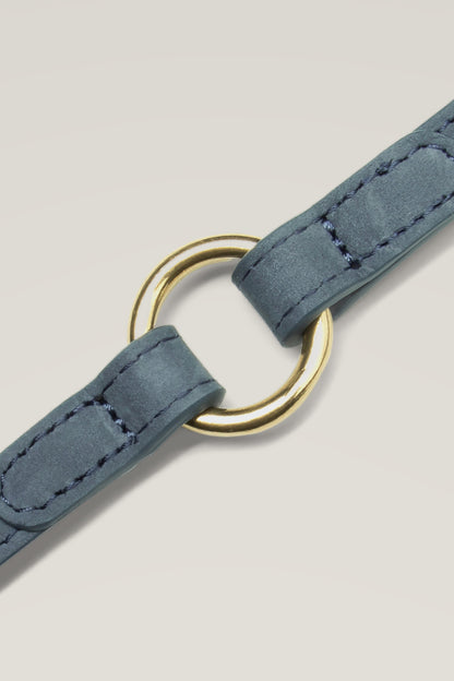 Dove grey nubuck leather and brass D-ring of the Cloud 7 Tiergarten dog collar, close-up
