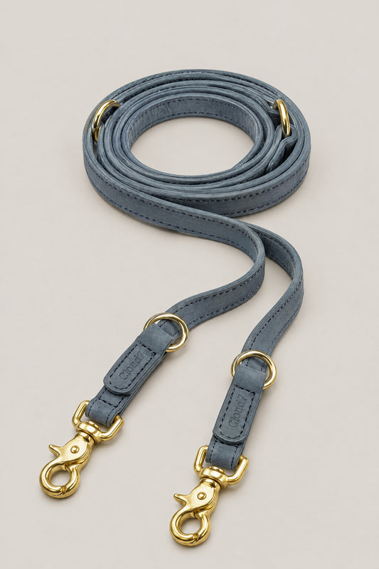 Dove grey nubuck leather Cloud 7 Tiergarten dog leash with brass snap hooks, coiled front view