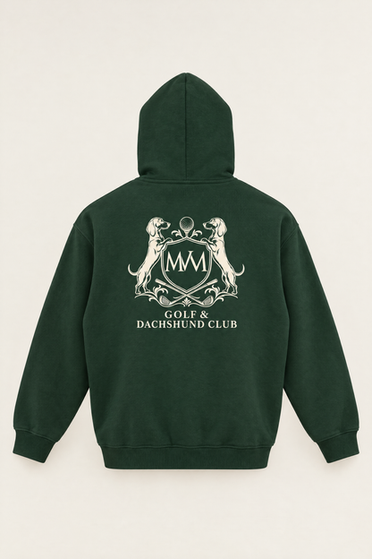 Back of the blackish green Club Crest hoodie with the large cream Golf & Dachshund Club crest below the hood. Color: Blackish Green