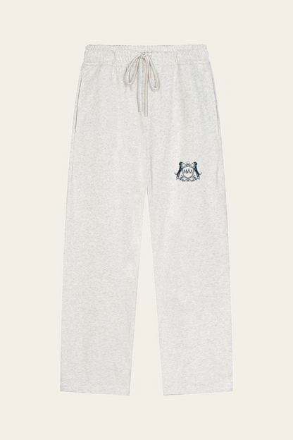 Flat lay of oat gray straight-leg Club Crest sweatpants with the small navy Golf & Dachshund Club crest on the upper thigh, front view. Color: Oat Gray