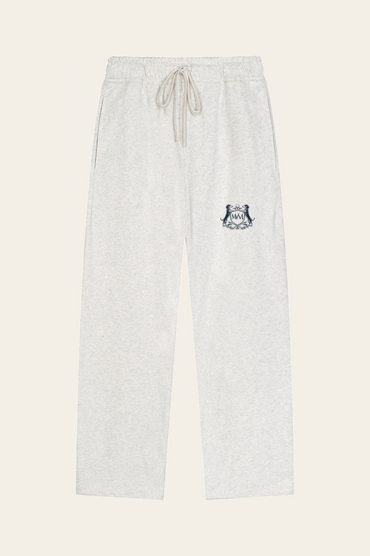 Flat lay of oat gray straight-leg Club Crest sweatpants with the small navy Golf & Dachshund Club crest on the upper thigh, front view. Color: Oat Gray
