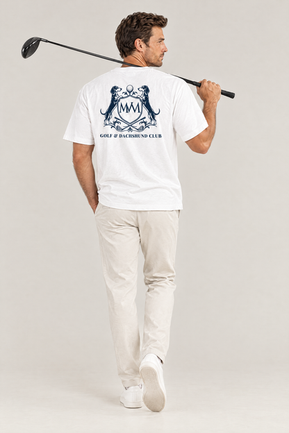 Man with a driver over his shoulder, back view of the white Club Crest tee with the large navy Golf & Dachshund Club crest