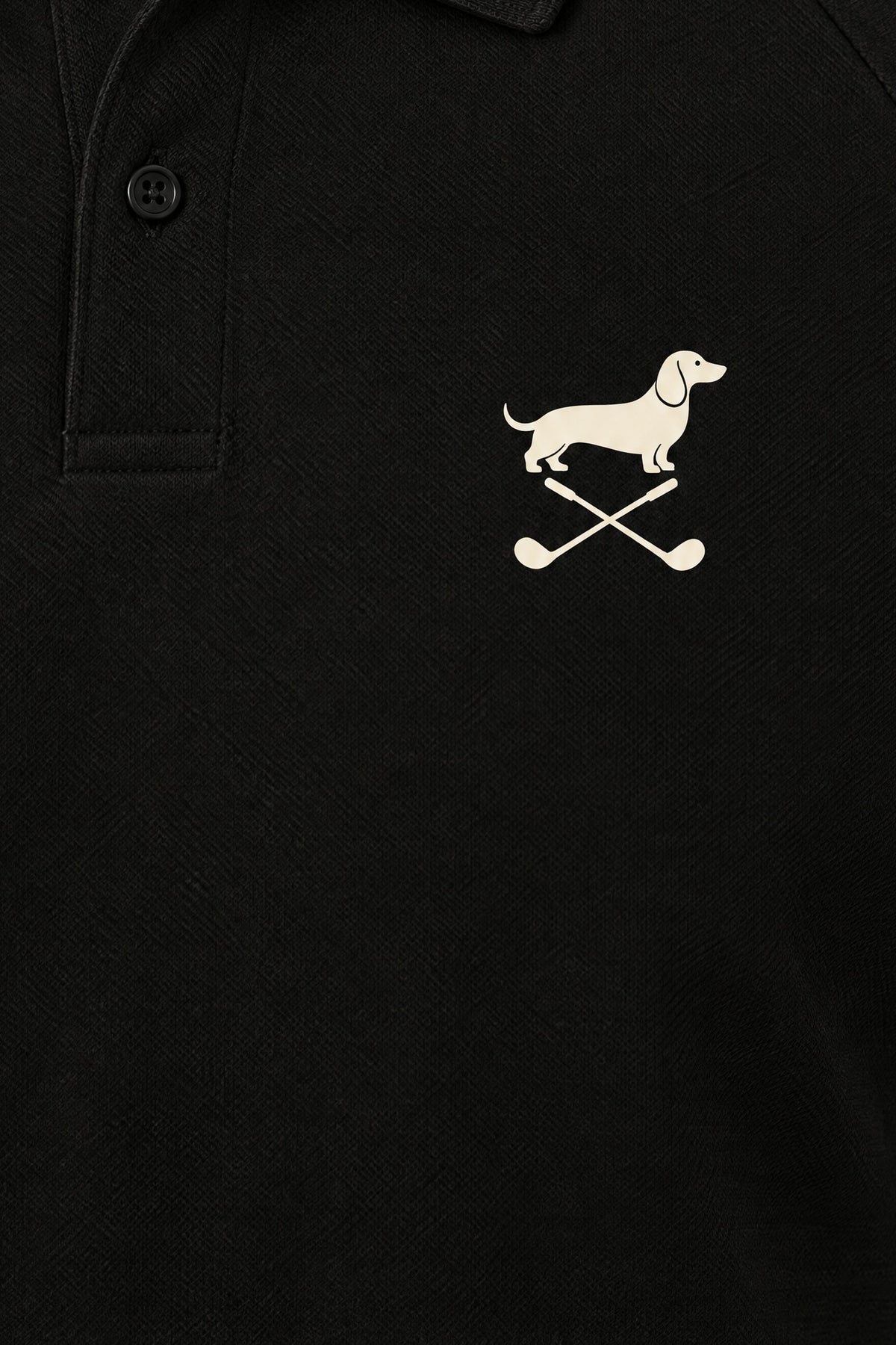 Close-up of the collar and chest logo on the black Club Mark dachshund golf polo. Color: Black
