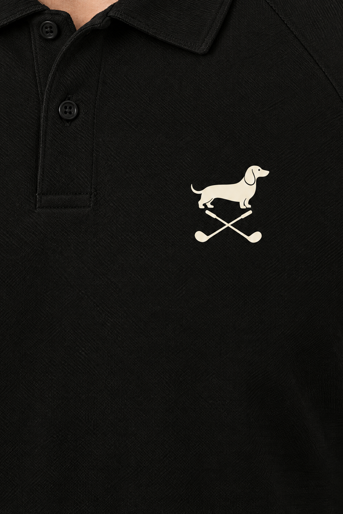 Close-up of the collar and chest logo on the black Club Mark dachshund golf polo. Color: Black