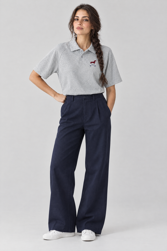 Woman standing with one hand on her hip in the flower gray Club Mark dachshund golf polo and navy wide-leg trousers. Color: Flower Gray