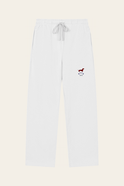 Flat lay of white straight-leg Club Mark sweatpants with the small red dachshund, crossed golf clubs and MVM monogram on the thigh, front view. Color: White