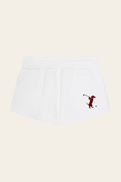 Flat lay of white Club Mark shorts with the red dachshund golfer print on the back, back view. Color: White