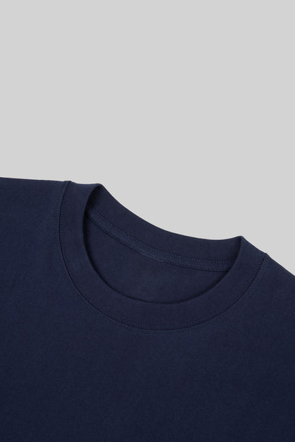Ribbed crew neck of the navy heavyweight cotton tee, close-up