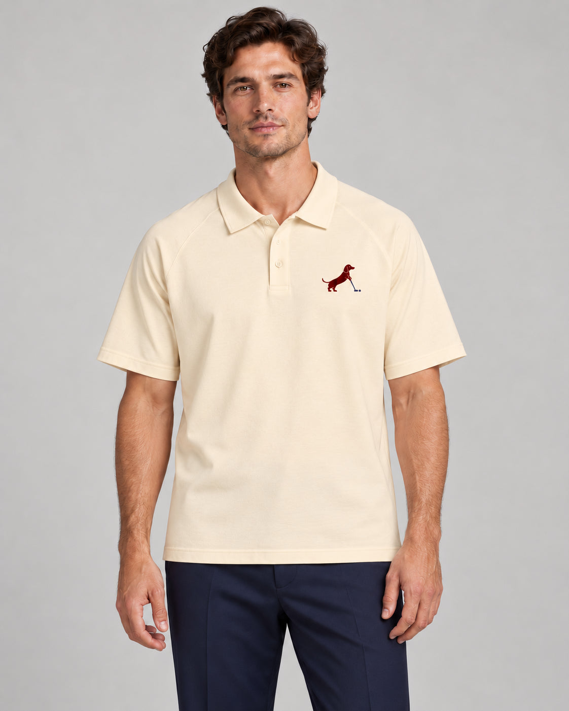 Man wearing Putting dachshund golf polo, front studio view. Color: Apricot