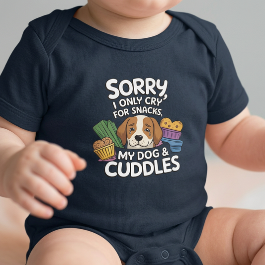 Baby wearing a navy blue onesie with a graphic and text about snacks, dog, and cuddles.