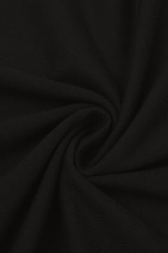 Close-up of the soft cotton fabric of the black golf t-shirt. Color: Black