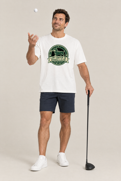 Man tossing a golf ball in the white Low Center of Gravity Club Dachshund Golf Tee. Color: White