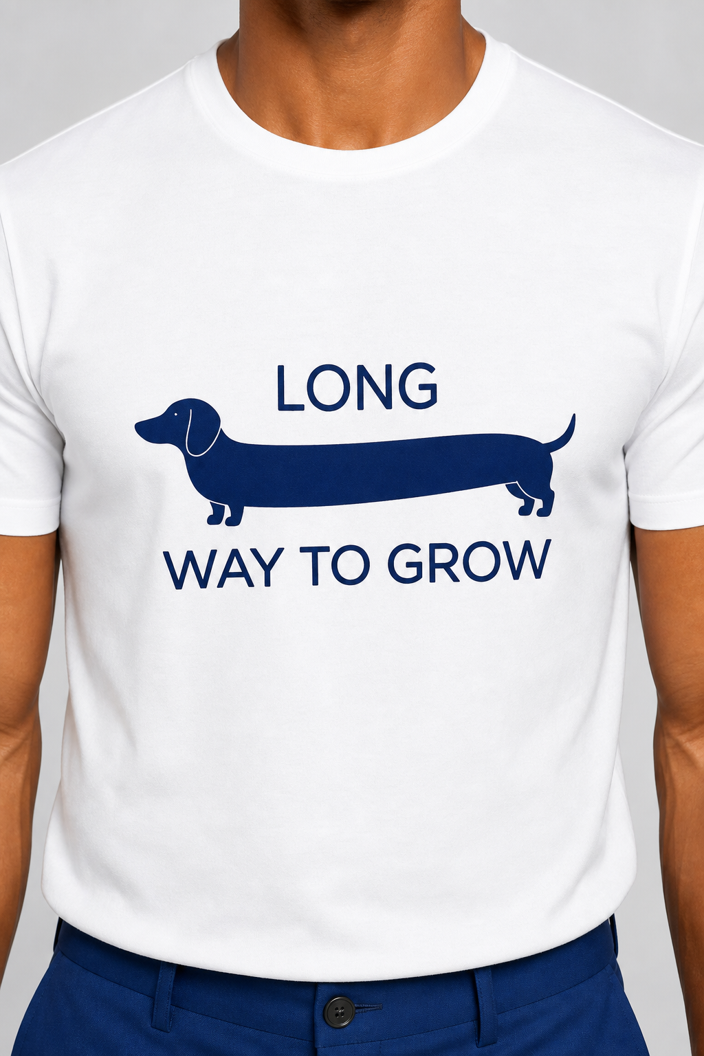 Man wearing white t-shirt with Long Way to Grow dachshund print