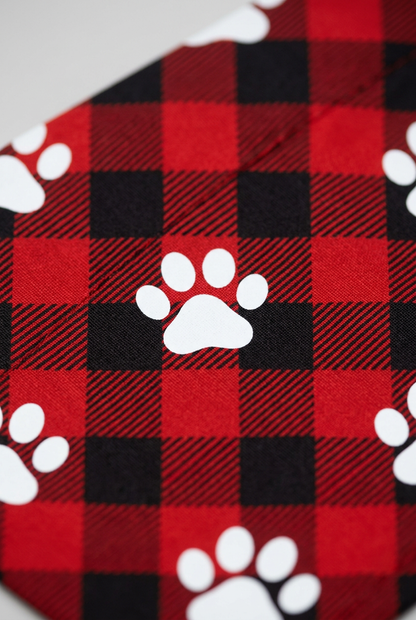 Paw print detail on red buffalo plaid dog bandana, triangle panel