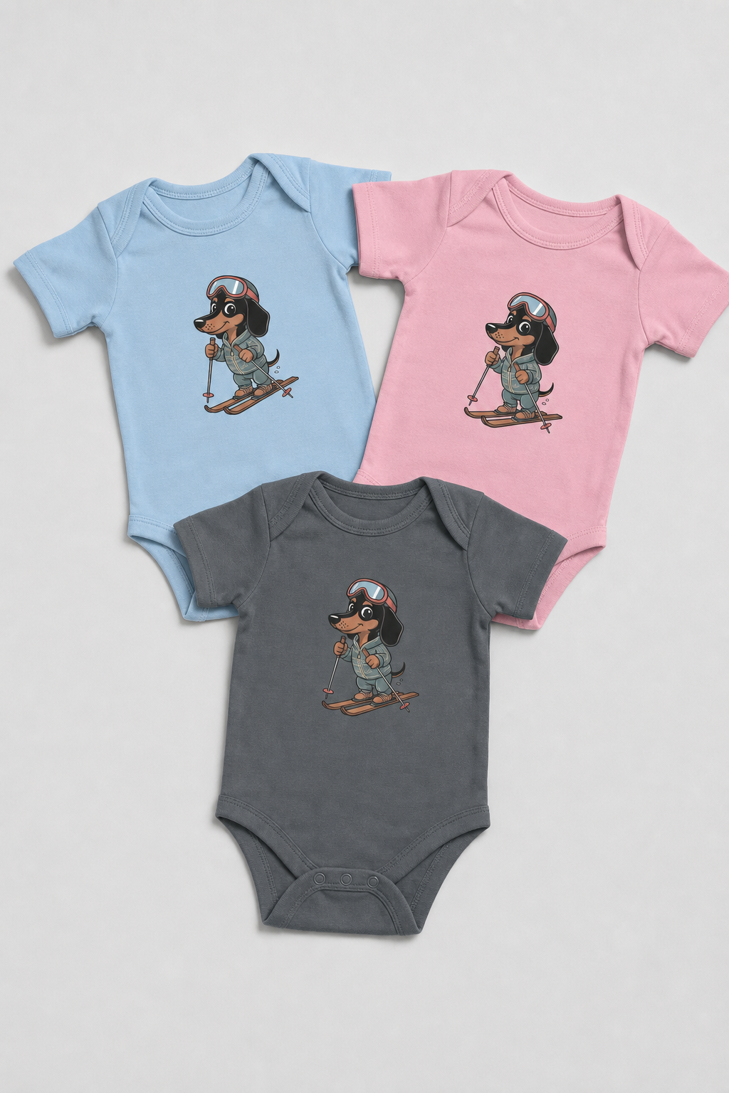 Baby wearing pink skiing dachshund bodysuit