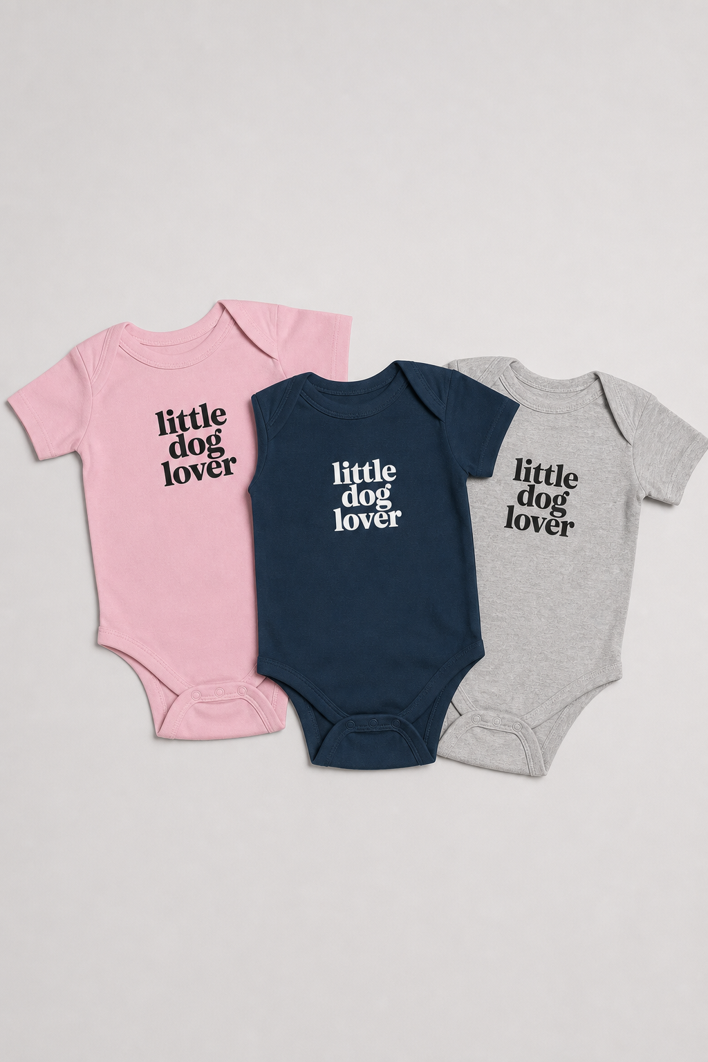 Baby wearing pink Little Dog Lover bodysuit