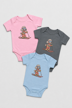 Baby wearing pink skiing poodle bodysuit